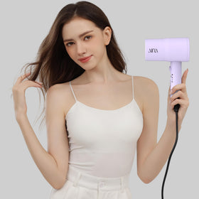 AINA dryer styling waves on model for shiny frizz-free results