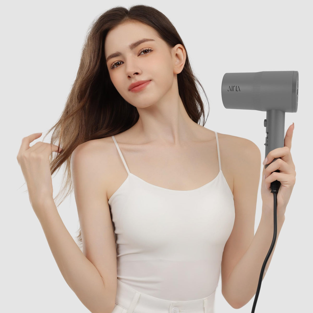 AINA hair dryer lifestyle bathroom setup demonstrating everyday styling convenience