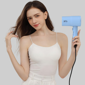 AINA hair dryer size scale with hand showing compact, ergonomic weight benefit