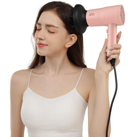 AINA in-use with diffuser creating defined curls and reduced frizz