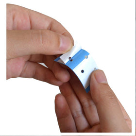 AIRAO tape placed under wig base illustrating clean placement and long-lasting hold