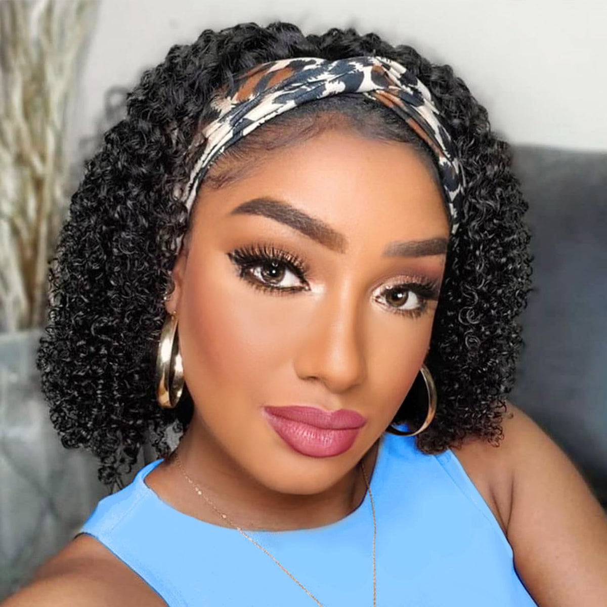 AISI QUEENS front view of curly headband wig showing natural hairline and volume