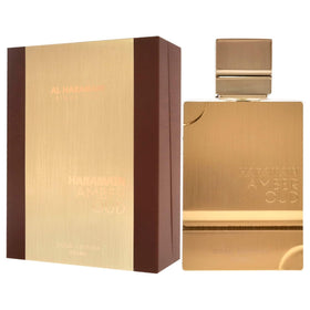 Al Haramain bottle in hand for scale showing 6.8 ounce size benefit: clear size reference