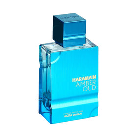 Al Haramain bottle held in hand showing 3.4oz scale and travel-ready size