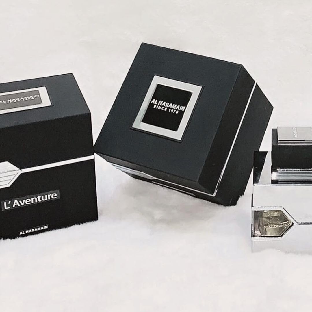 Al Haramain L'Aventure 100 ml beside common items for scale, clarifies true bottle size
