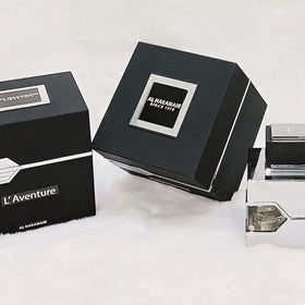 Al Haramain L'Aventure 100 ml beside common items for scale, clarifies true bottle size