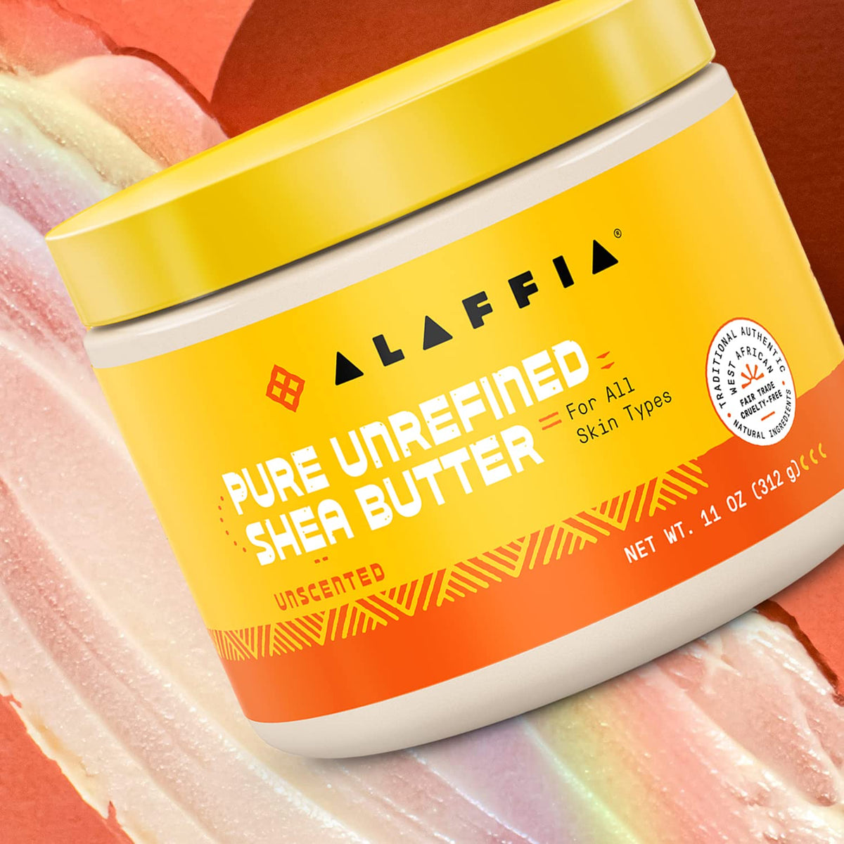 Alaffia close-up scoop of shea butter on palm demonstrating easy warming and spreadable benefit