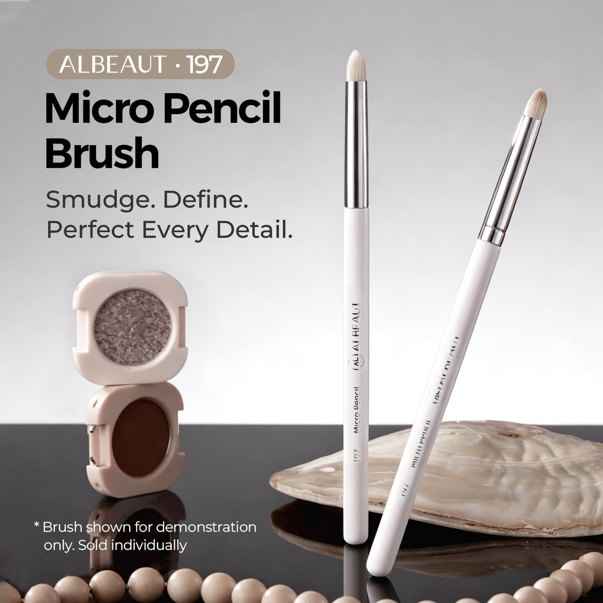 ALBEAUT brush picking up powder to demonstrate strong color payoff