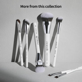 ALBEAUT brush held in hand showing compact size for on-the-go use