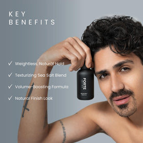 Alex Costa sea-salt spray on bathroom counter among styling tools, fast pre-styling benefit