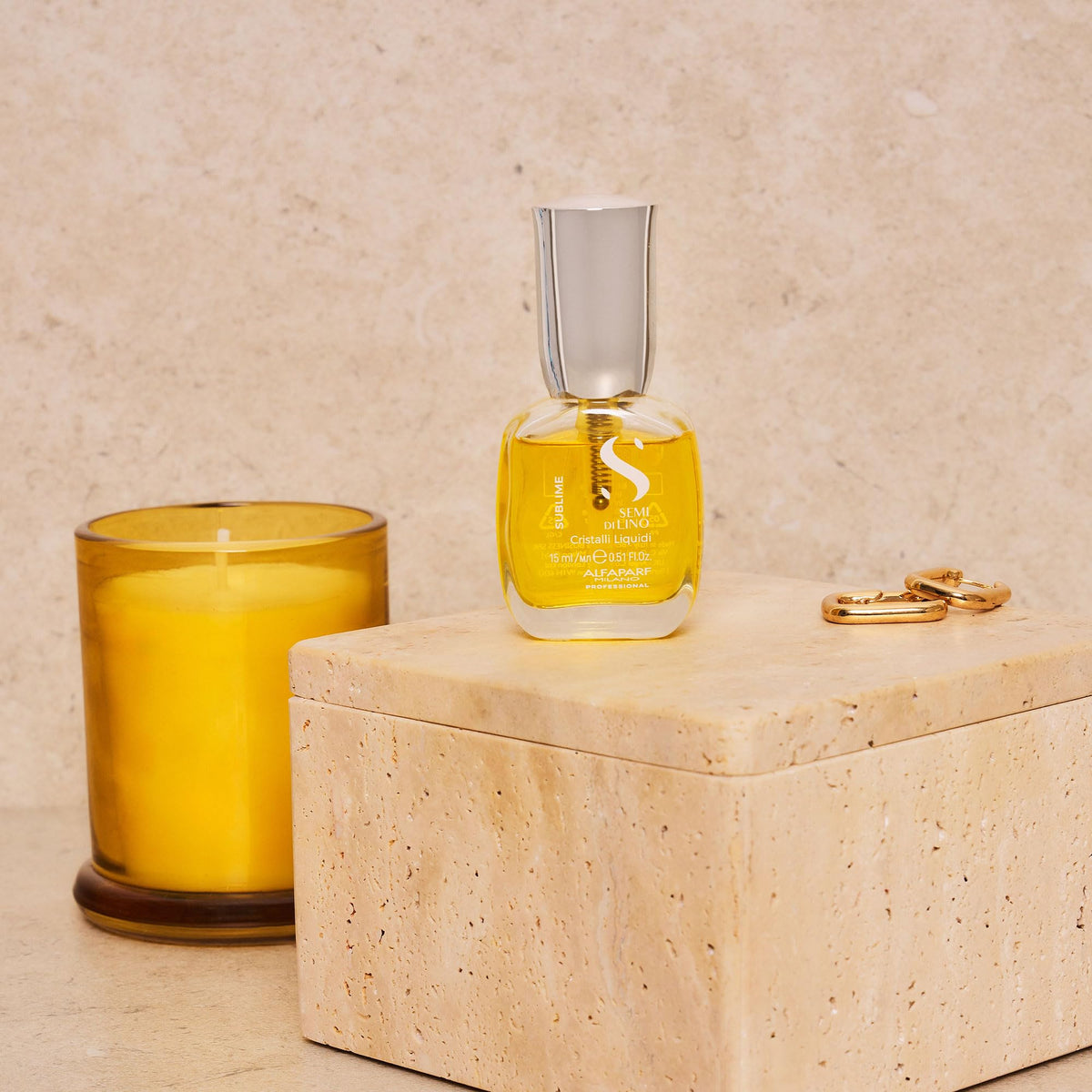 ALFAPARF MILANO applying serum to damp hair to speed drying and ease styling