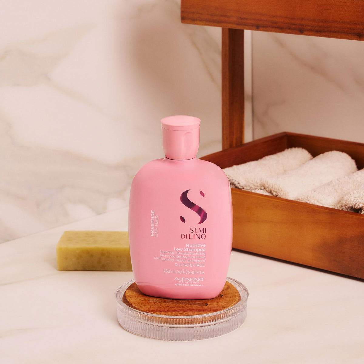 ALFAPARF MILANO shampoo poured into palm showing easy lather and manageable application