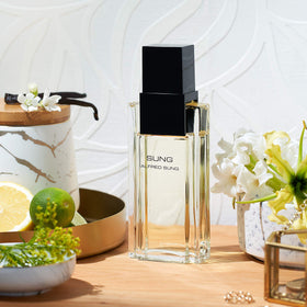 ALFRED SUNG cap and label detail showing brand logo and premium presentation