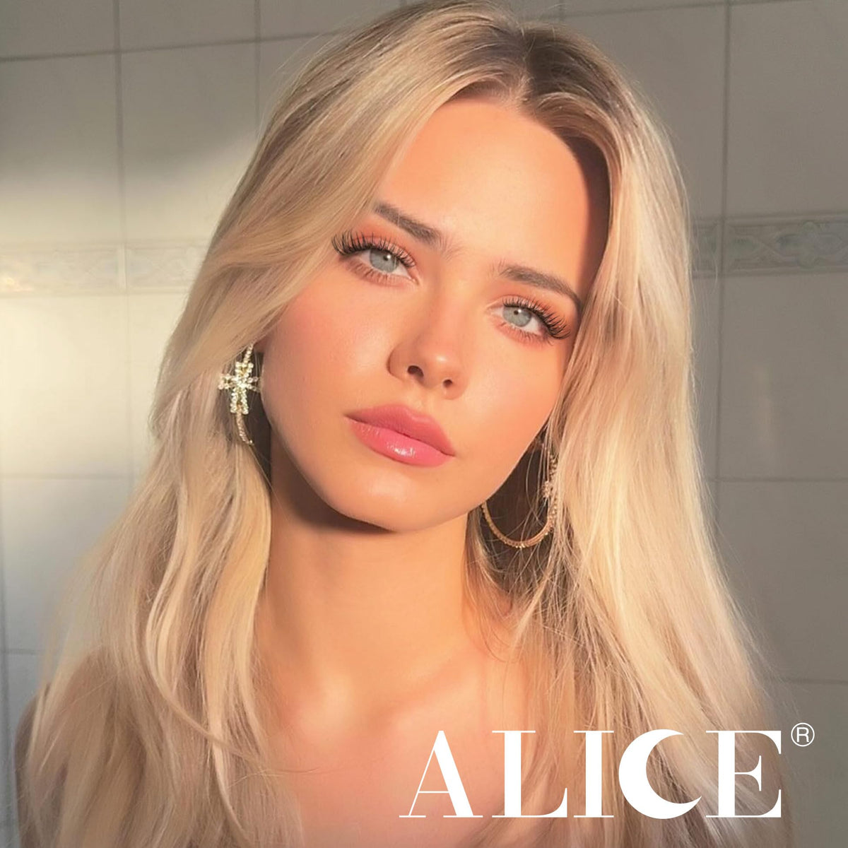 ALICE hand applying a cluster lash to show DIY ease and quick results