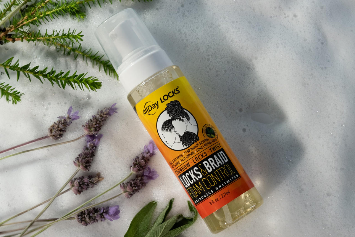 AllDay Locks applying mousse to finished braids to reduce frizz and seal style benefit