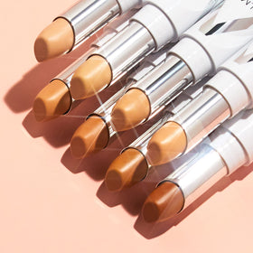 Almay shade swatch on arm showing 140 Light/Medium and true-to-skin match benefit