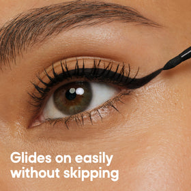 Almay eyeliner black stroke on skin showing intense color payoff