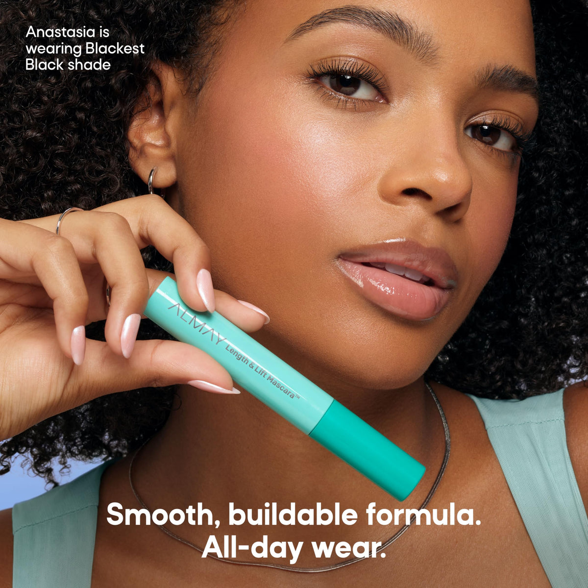 Almay model wearing mascara illustrating natural lift and definition benefit