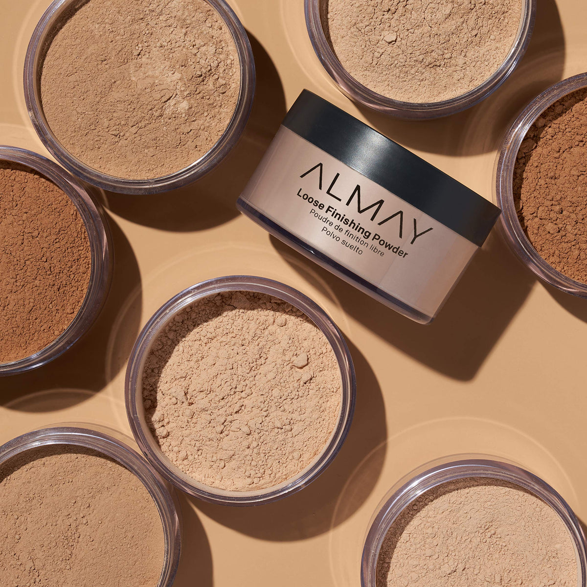 Almay model applying powder to t-zone for reduced shine and longevity
