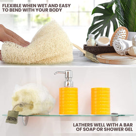 ALMOONI loofah held in hand displaying size and easy grip benefit