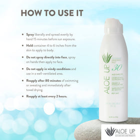 ALOE UP bottle in hand demonstrating 4 oz travel size and portability benefit
