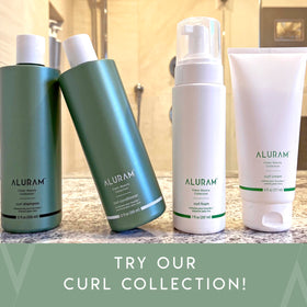 ALURAM being applied to curly hair to enhance natural pattern
