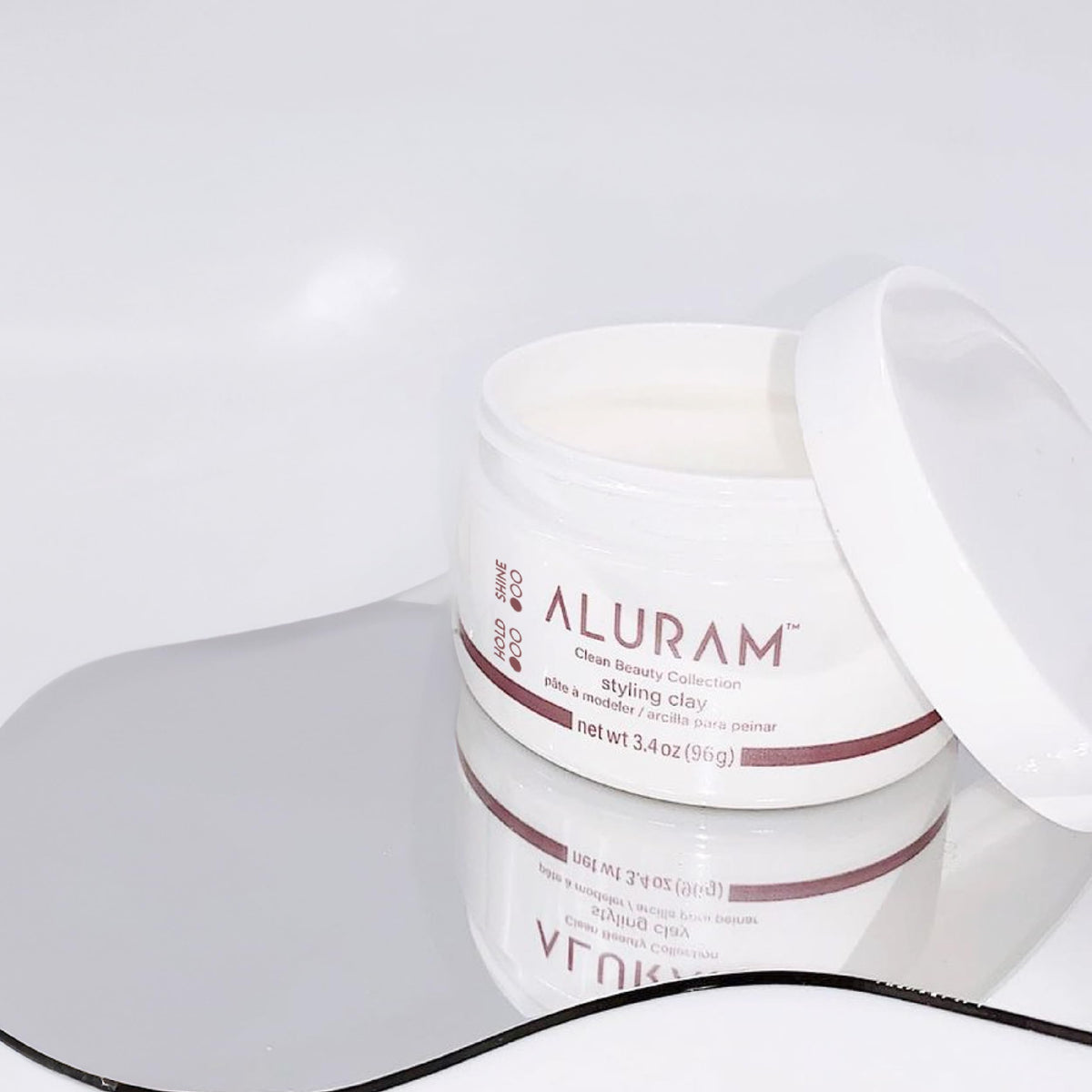 ALURAM open jar close-up showing clay texture for smooth application benefit