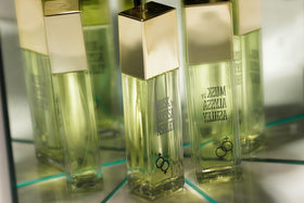 ALYSSA ASHLEY bottle in evening setting conveying warm, sensual finish for nights out