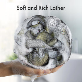 AmazerBath hanging loop and size beside a hand for scale and quick-dry storage benefit