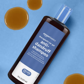 Amazon Basics shampoo in shower setting showing real-use application and symptom control benefit