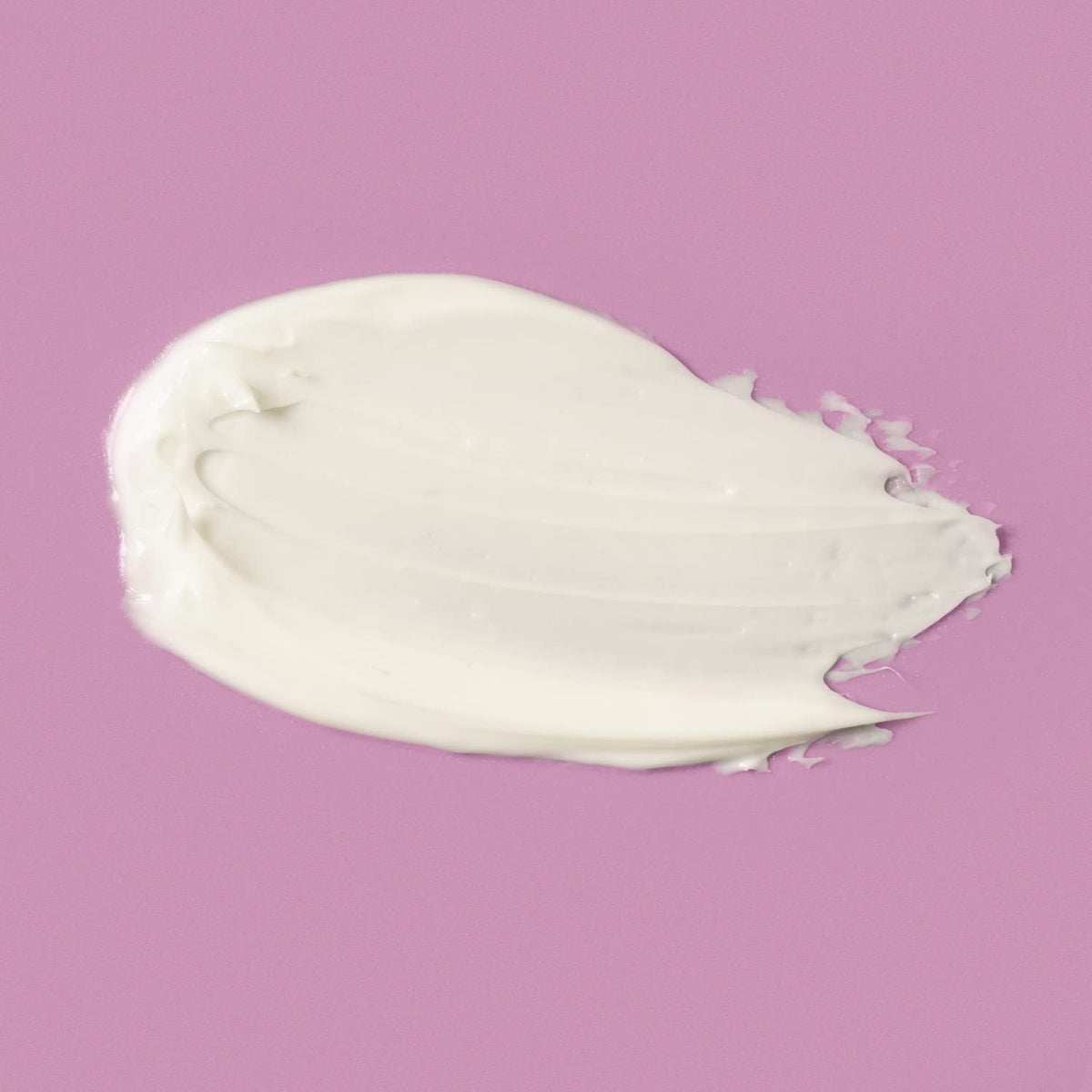 Amazon Basics cream on fingers ready to apply for immediate moisturizing benefit
