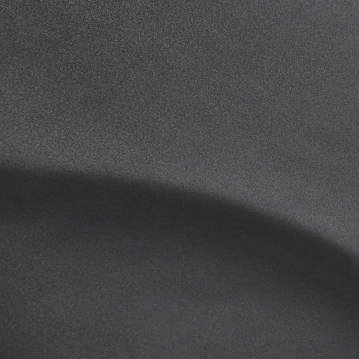 Amazon Basics mat placed behind a barber chair illustrating comfort and waterproof cleanup benefits
