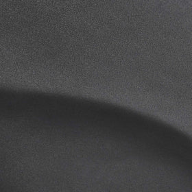 Amazon Basics mat placed behind a barber chair illustrating comfort and waterproof cleanup benefits