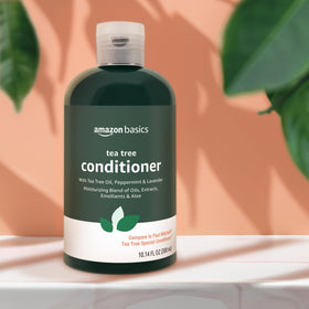 Amazon Basics conditioner on bathroom shelf staged to show everyday routine and herbal scent