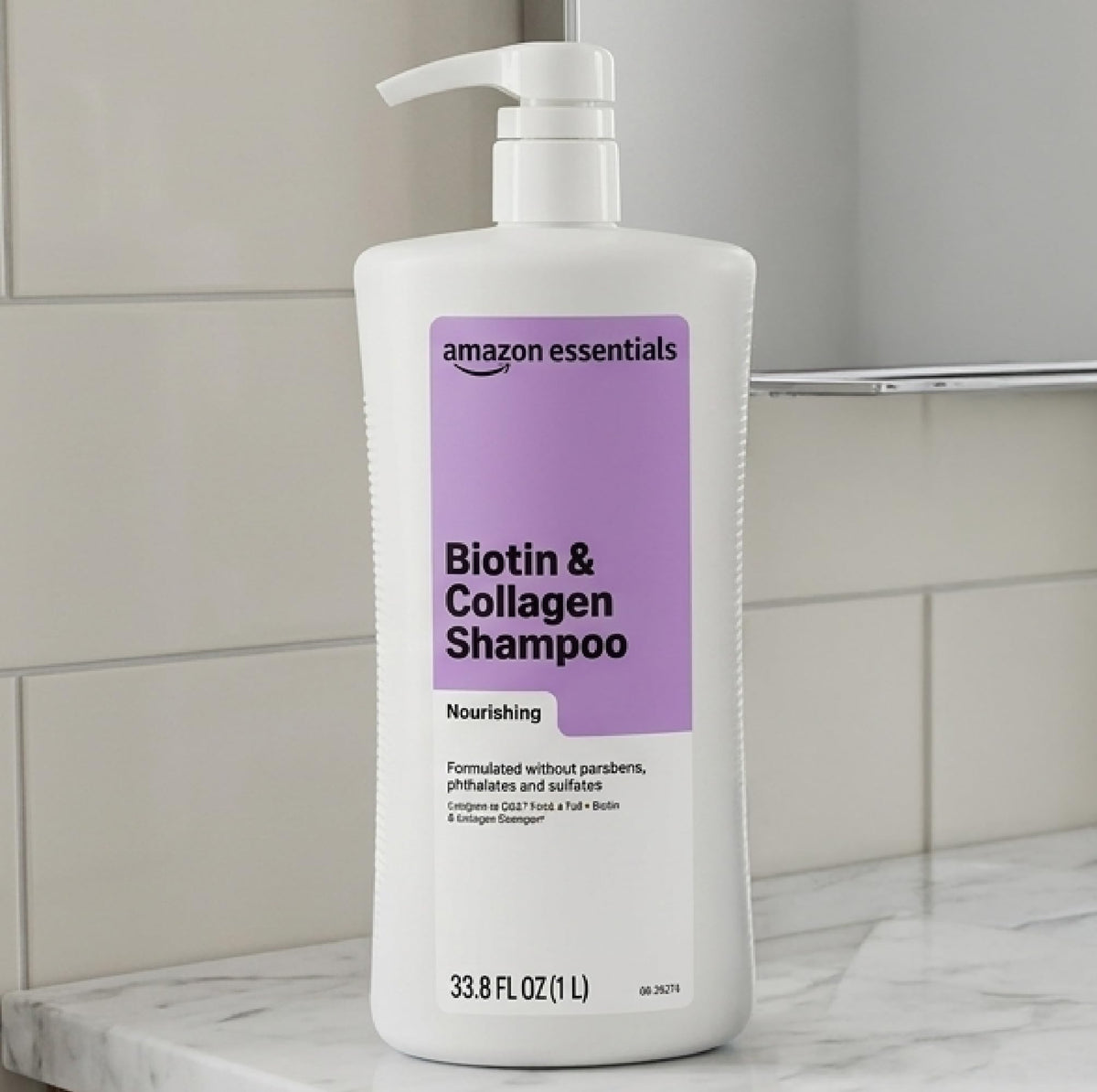 Amazon Essentials bottle in hand dispensing product for easy application benefit