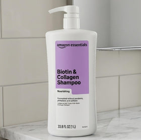 Amazon Essentials bottle in hand dispensing product for easy application benefit