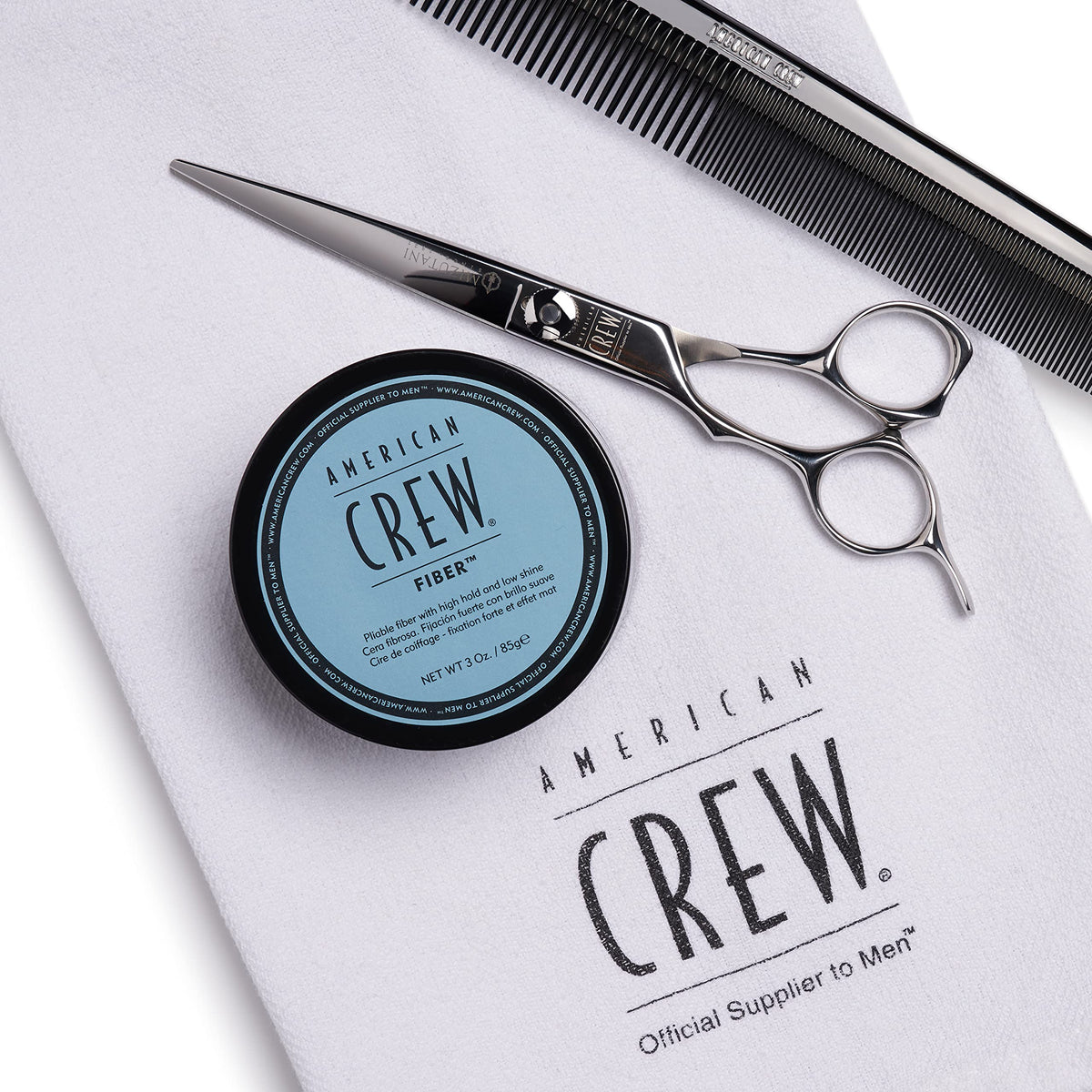 American Crew jar being applied to short hair, showing added texture and fuller look