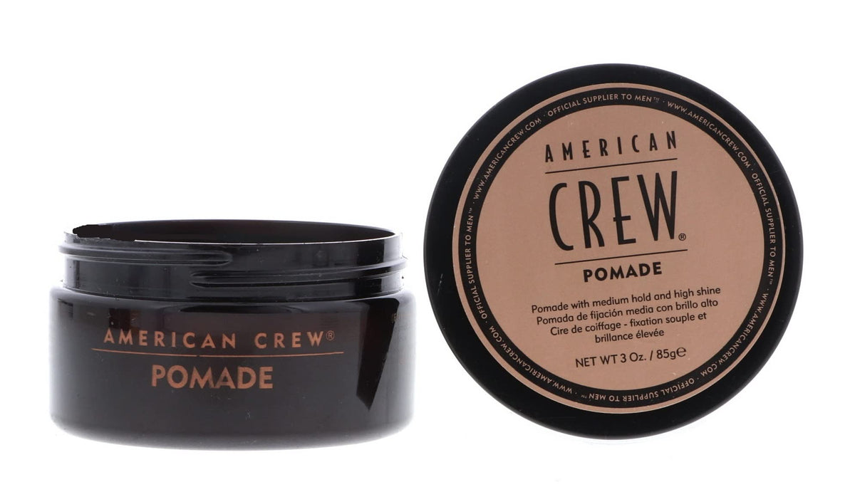 American Crew pomade being rubbed between hands for even application and control