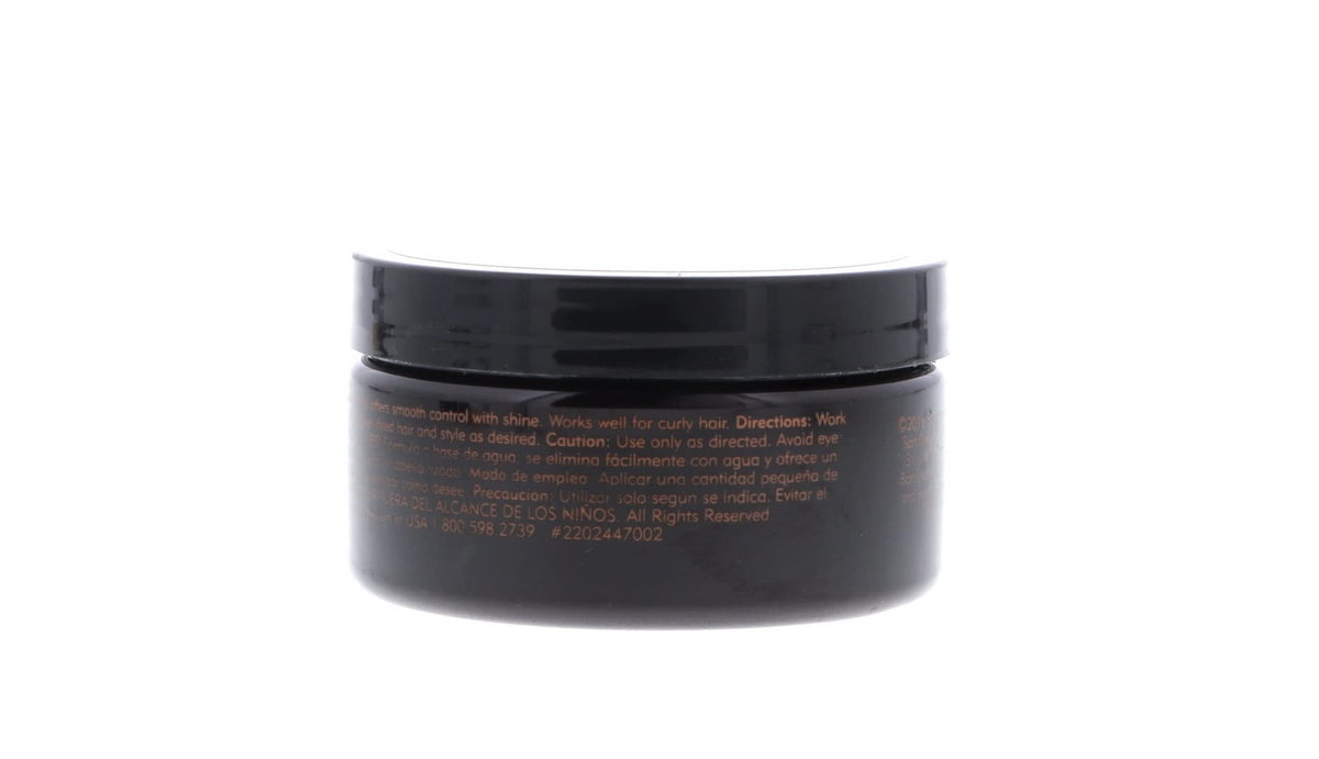 American Crew pomade on bathroom counter with grooming items, communicates everyday use
