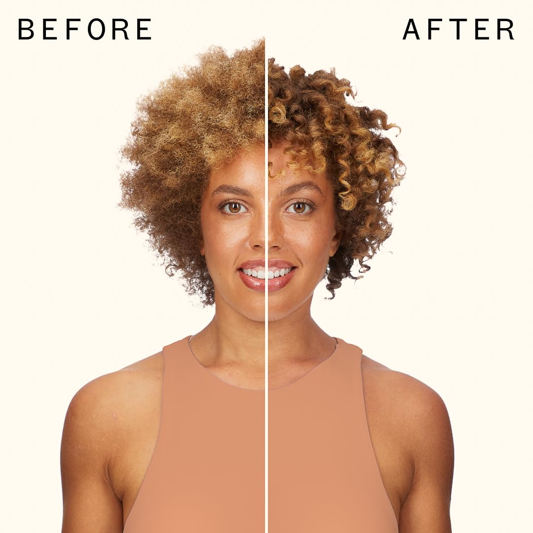 Model scrunching wet curls with Amika demonstrating defined, bouncy curl benefit