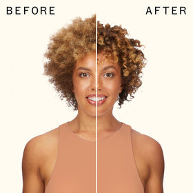 Model scrunching wet curls with Amika demonstrating defined, bouncy curl benefit