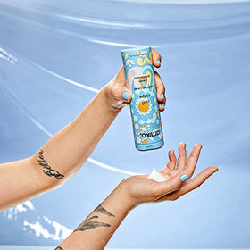 Amika Curl Corps next to a ruler showing 200ml size for value and portability