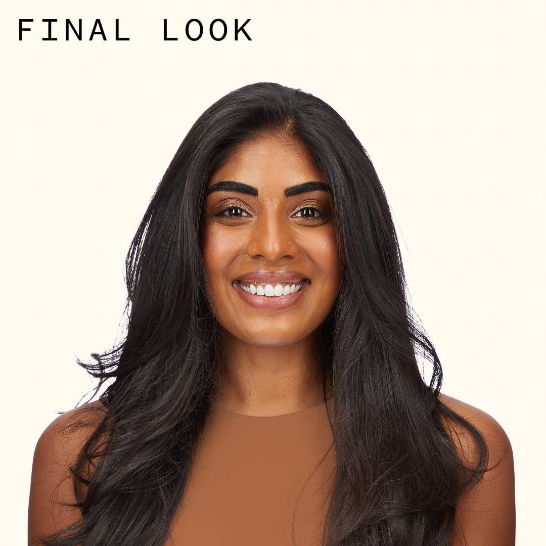 amika applying mousse to damp hair for immediate lift