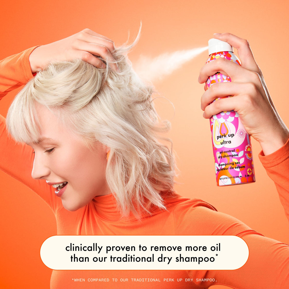 Amika spray applied at roots to absorb oil and refresh hair