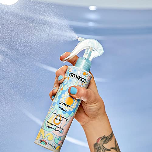 amika bottle placed in travel bag illustrating portability and styling on-the-go