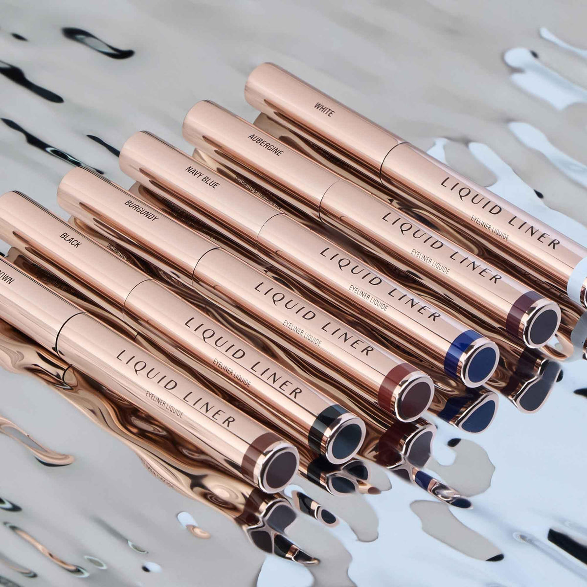Anastasia Beverly Hills liner next to coin showing slim size and portability