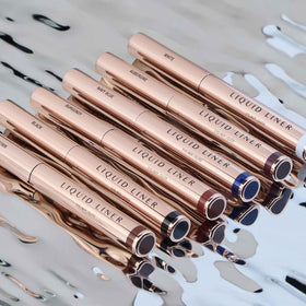 Anastasia Beverly Hills liner next to coin showing slim size and portability