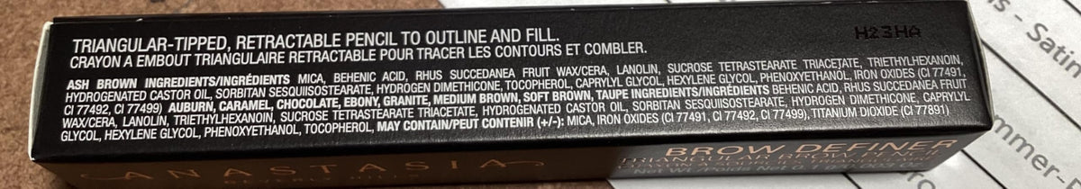 Anastasia Brow Definer scale next to fingers showing compact size and easy handling