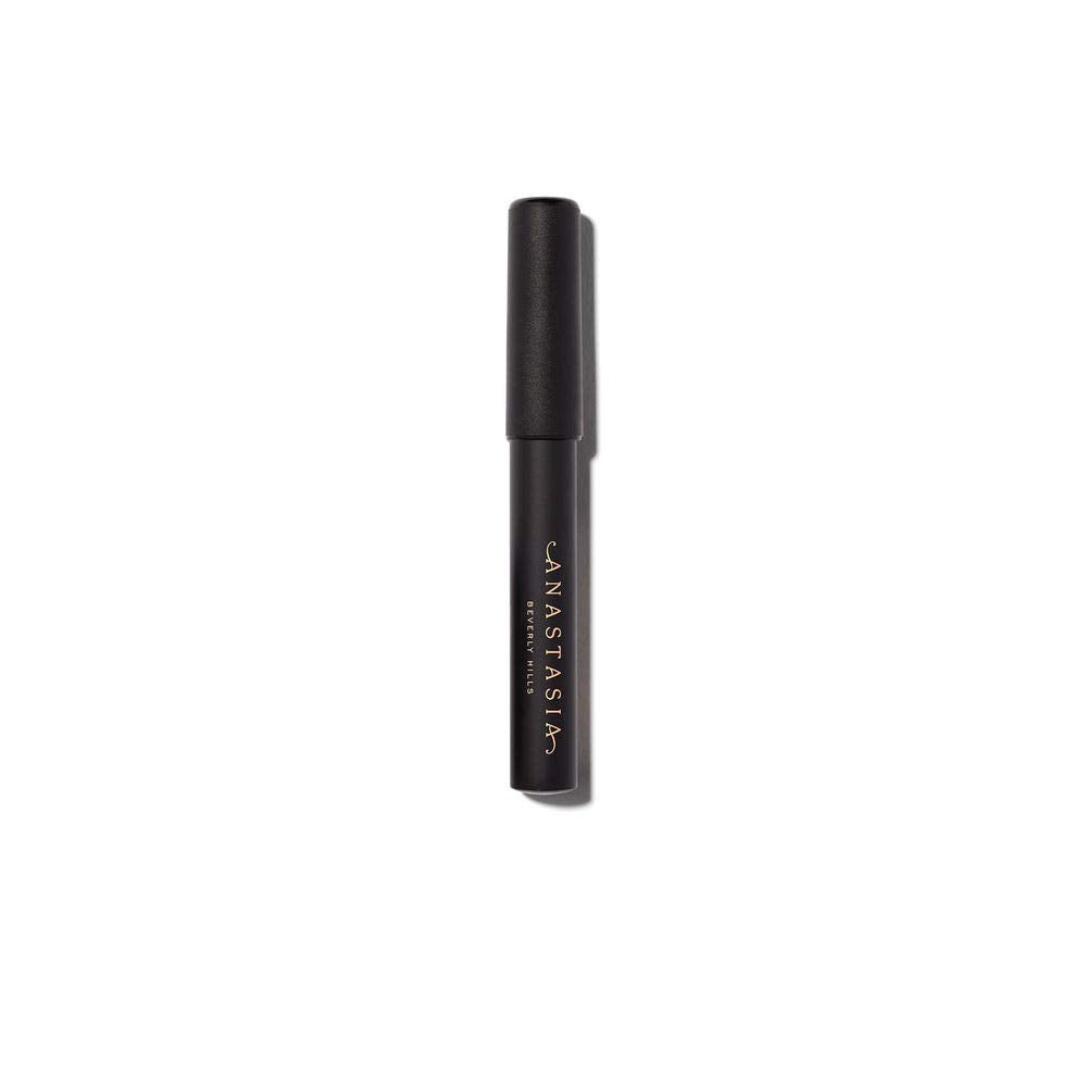 Anastasia Beverly Hills brow primer being applied close-up to lift hairs and improve hold