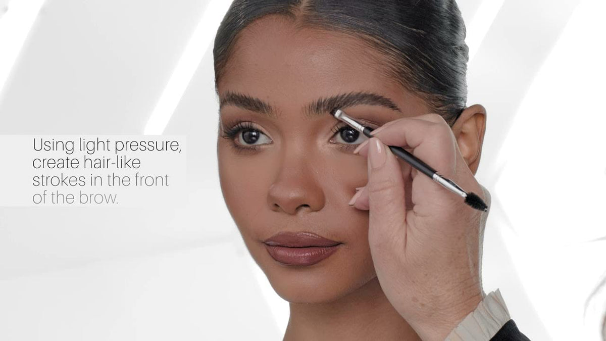 Anastasia Beverly Hills Brush 12 in-use applying DIPBROW Pomade for sharp, defined arches